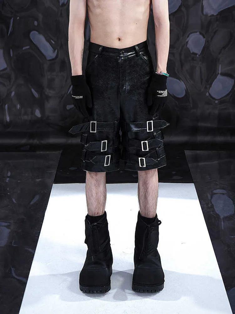 Men's black PU leather casual cropped shorts showing medium-low waist and polycarbaminate fibre material.