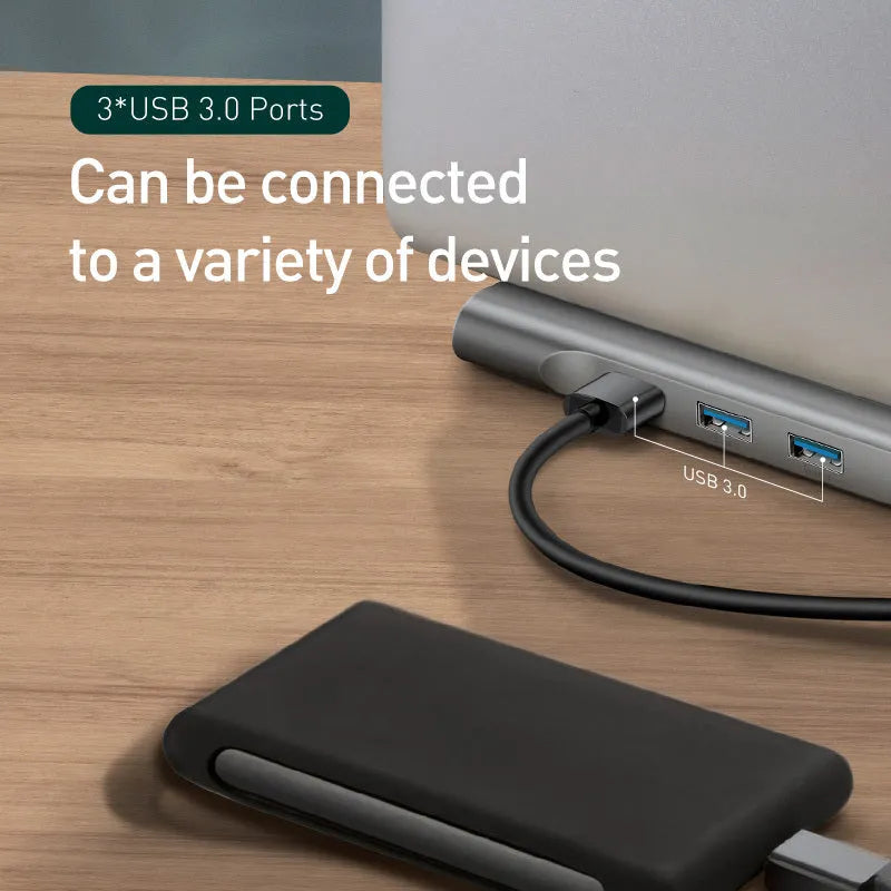 Grey aluminium ten-port laptop docking station with cooling bracket showing HDMI, VGA, and USB ports