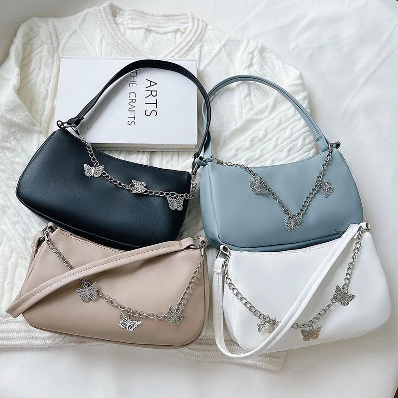 Horizontal square PU leather chain crossbody bag in light blue with an external pocket.