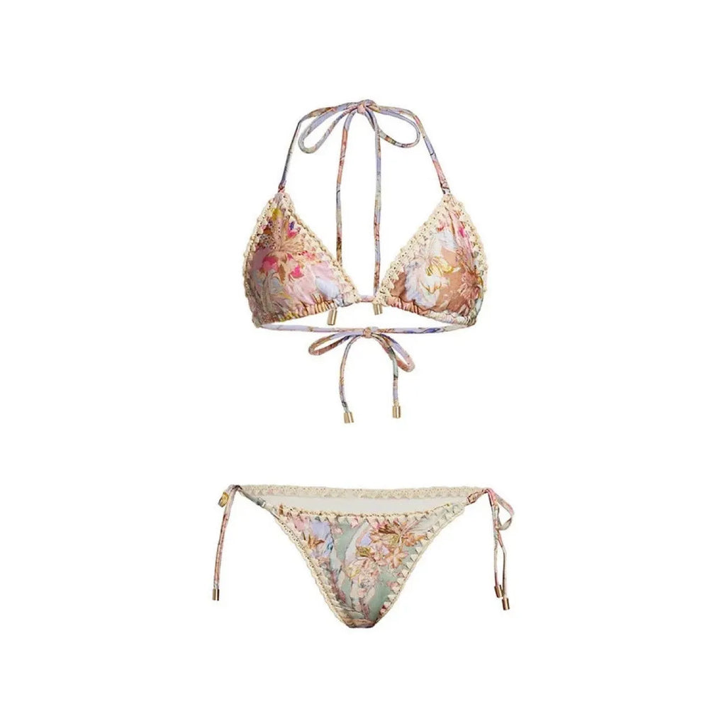 Women's creamy-white floral print bikini set with top, briefs, and skirt laid flat.