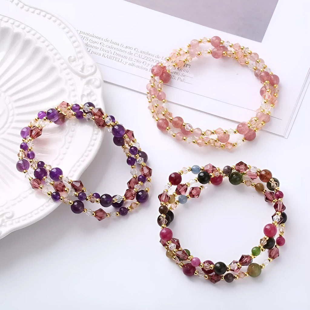 Women's adjustable crystal bracelet with tourmaline, strawberry quartz and amethyst beads on three-ring design