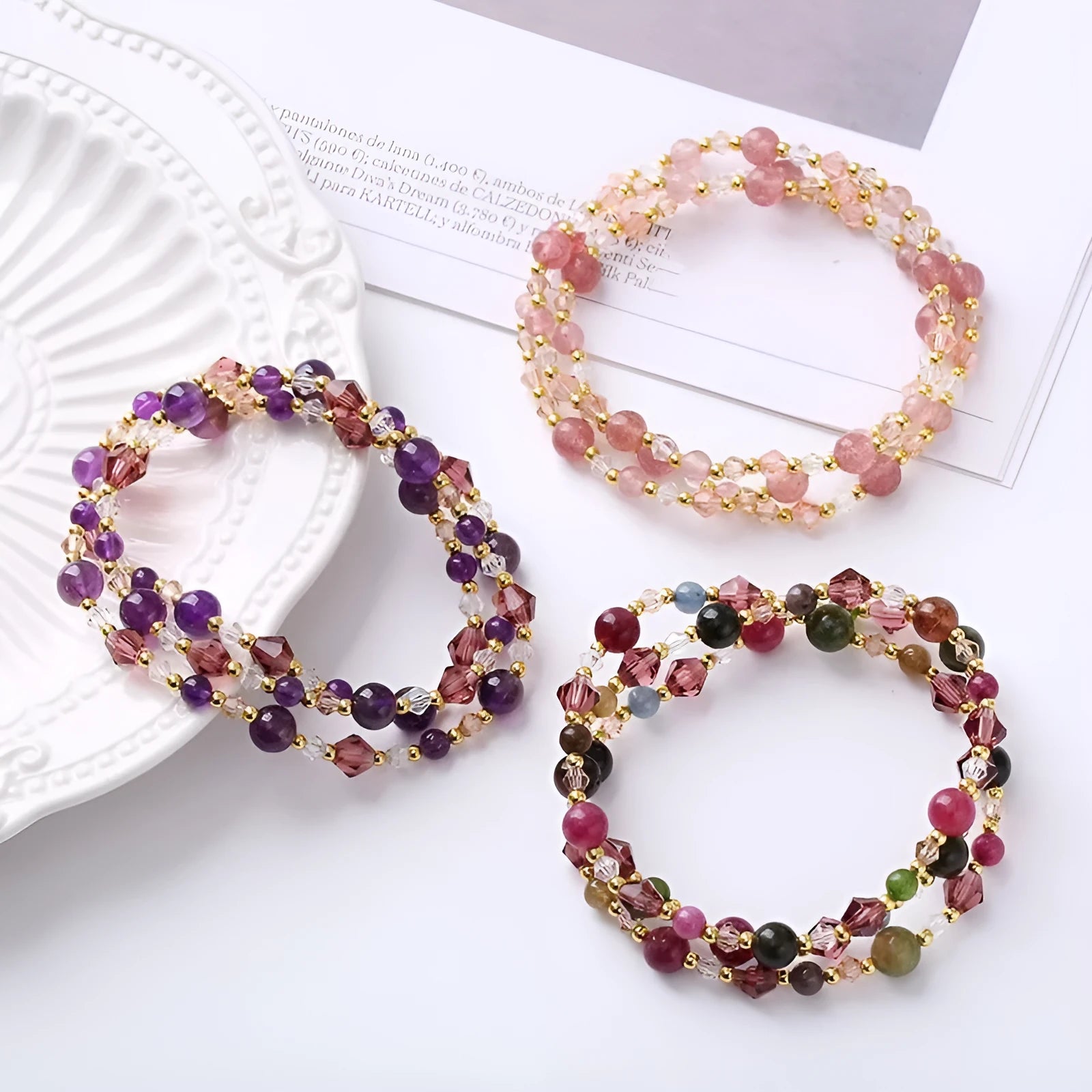Women's adjustable crystal bracelet with tourmaline, strawberry quartz and amethyst beads on three-ring design