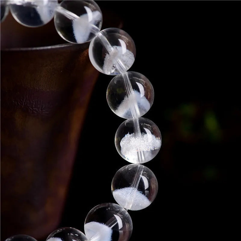 White crystal pyramid bracelet with ghost-like surface and Ruyi design elements showing multiple size options