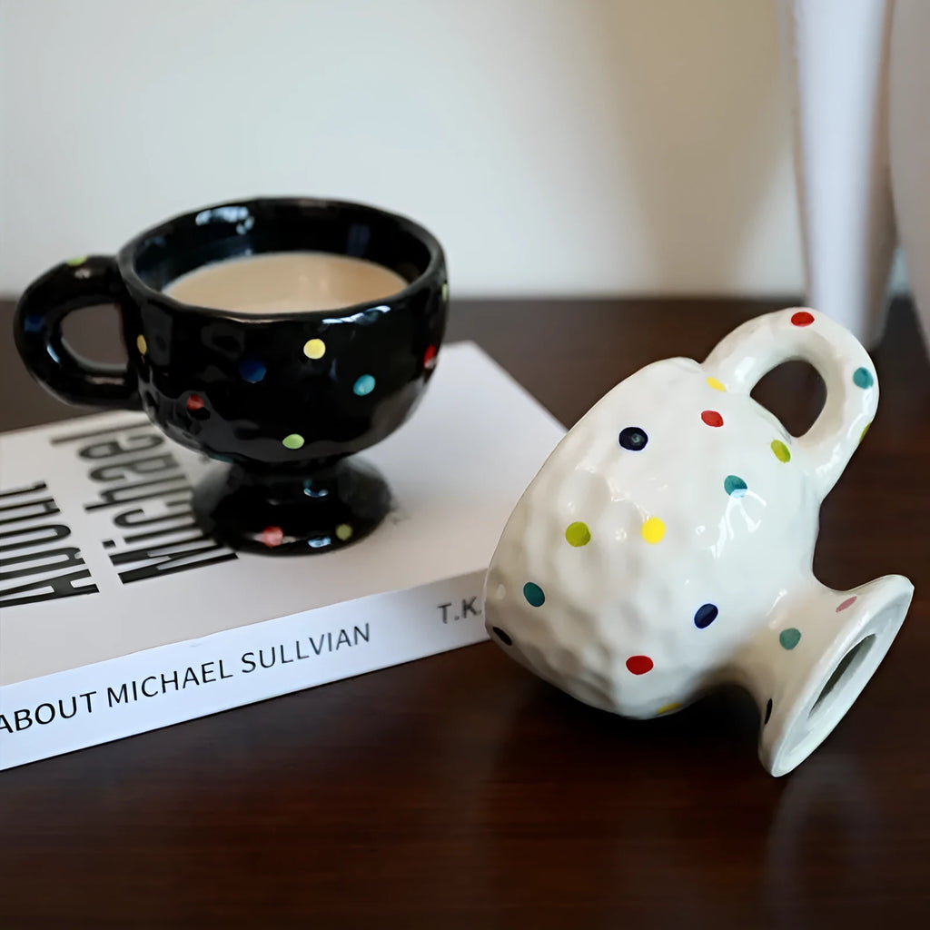 Hand-pinched irregular ceramic mug in a solid colour, shown from the side to display its unique shape.