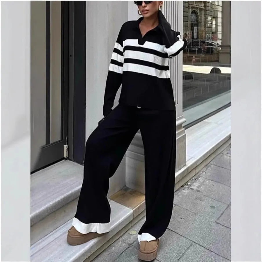 Women's black and white striped knitted two-piece set with polo collar shirt and matching trousers