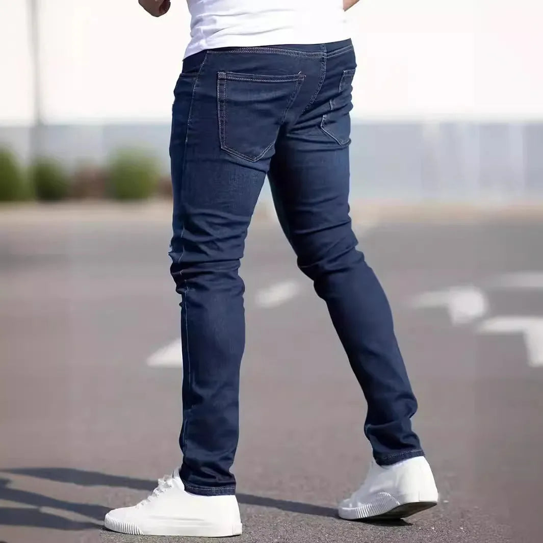 Men's dark blue slim-fit casual jeans with skinny leg and zip fly.