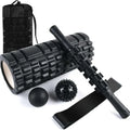 Black 33cm long fitness foam roller with six segmented pieces on a plain background.