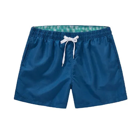 Men's polyester beach shorts in multiple colours with straight leg opening, suitable for surfing and swimming