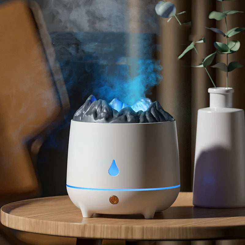 White volcano-shaped ultrasonic humidifier with USB cable on wooden table