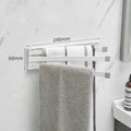 Nordic folding towel rack in carbon steel with black or white finish, mounted with adhesive without drilling