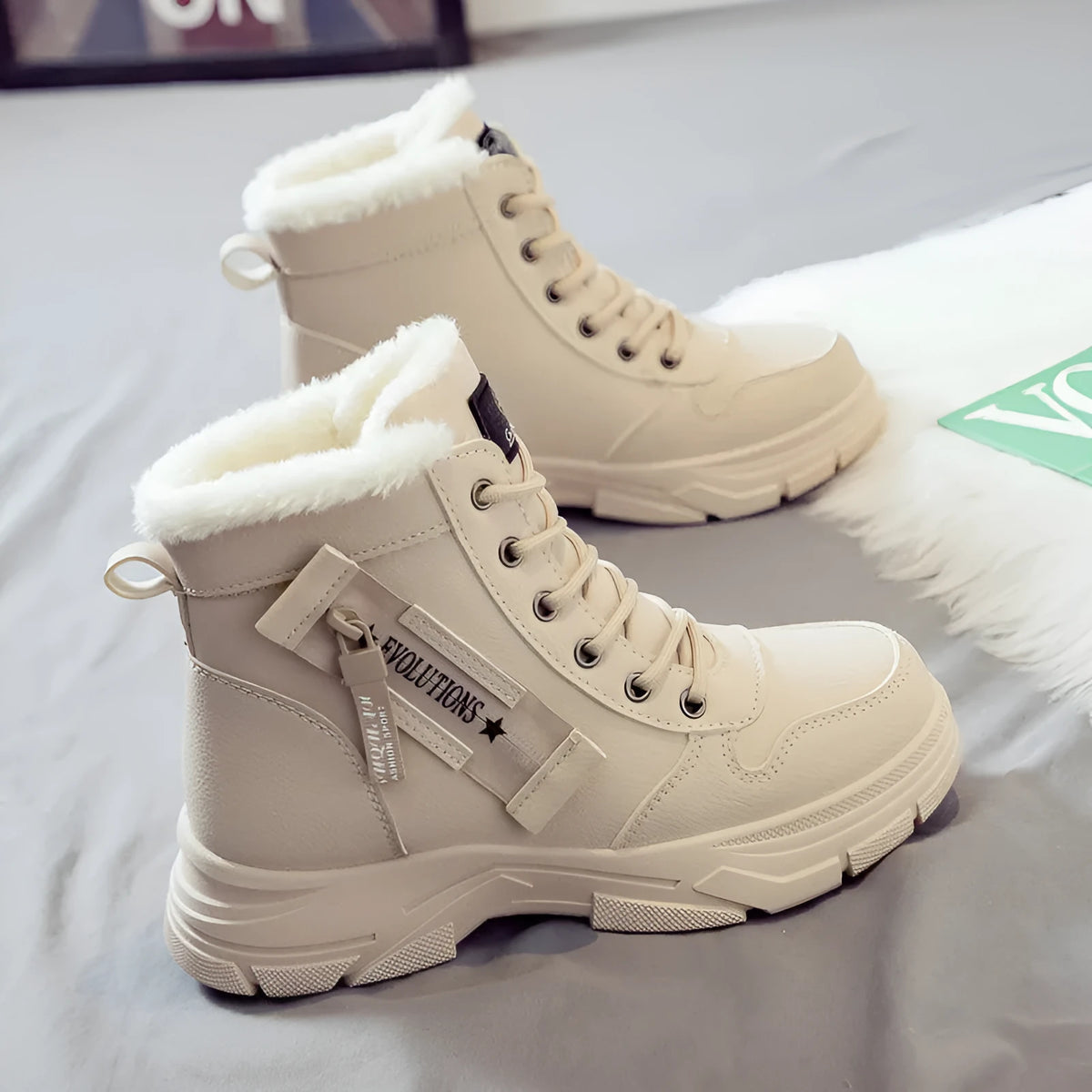Women's plus size tall snow boot in black with front laces and a mid heel.