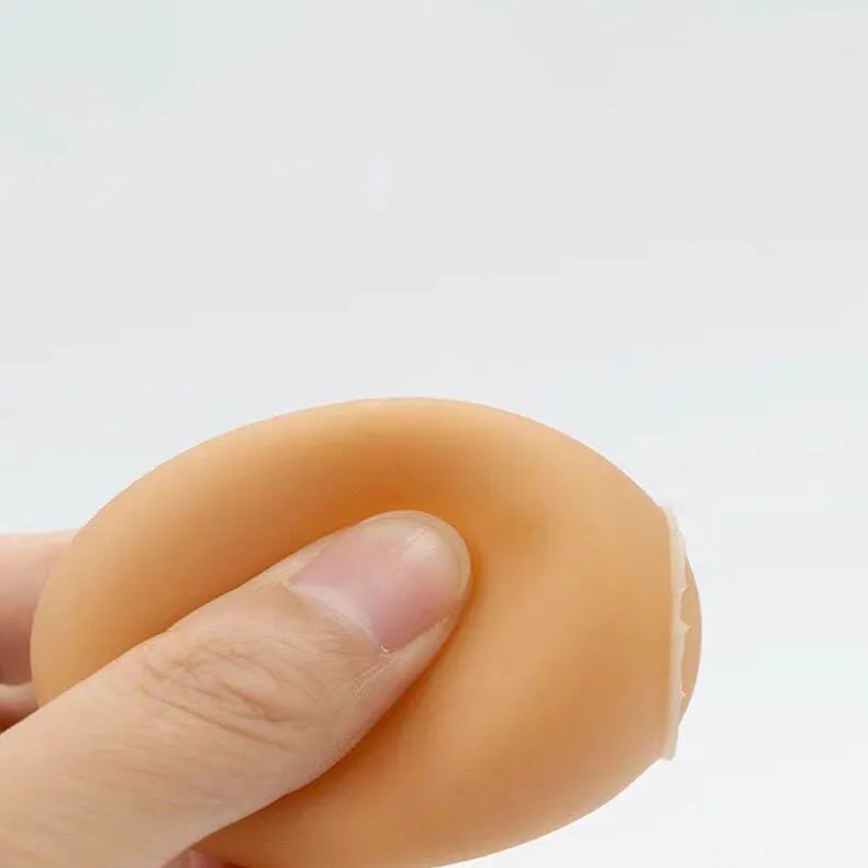Orange rubber egg-shaped dog chew toy with crinkly sound for small medium breeds