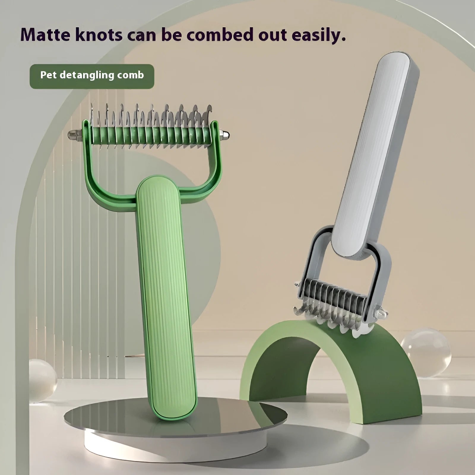 Green and grey dog detangling comb with stainless steel teeth and plastic handle in large and small sizes