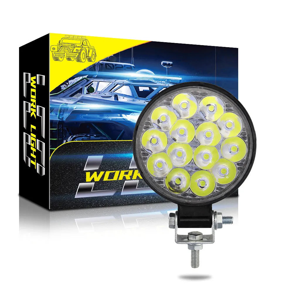White aluminium mini round 42W LED work light with IP67 waterproof rating for vehicles and machinery.