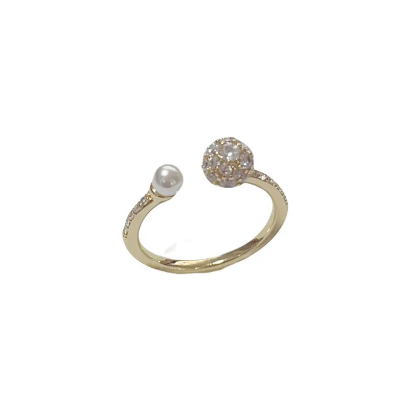 Open-end geometric pearl ring with round zircon elements and thick gold plating