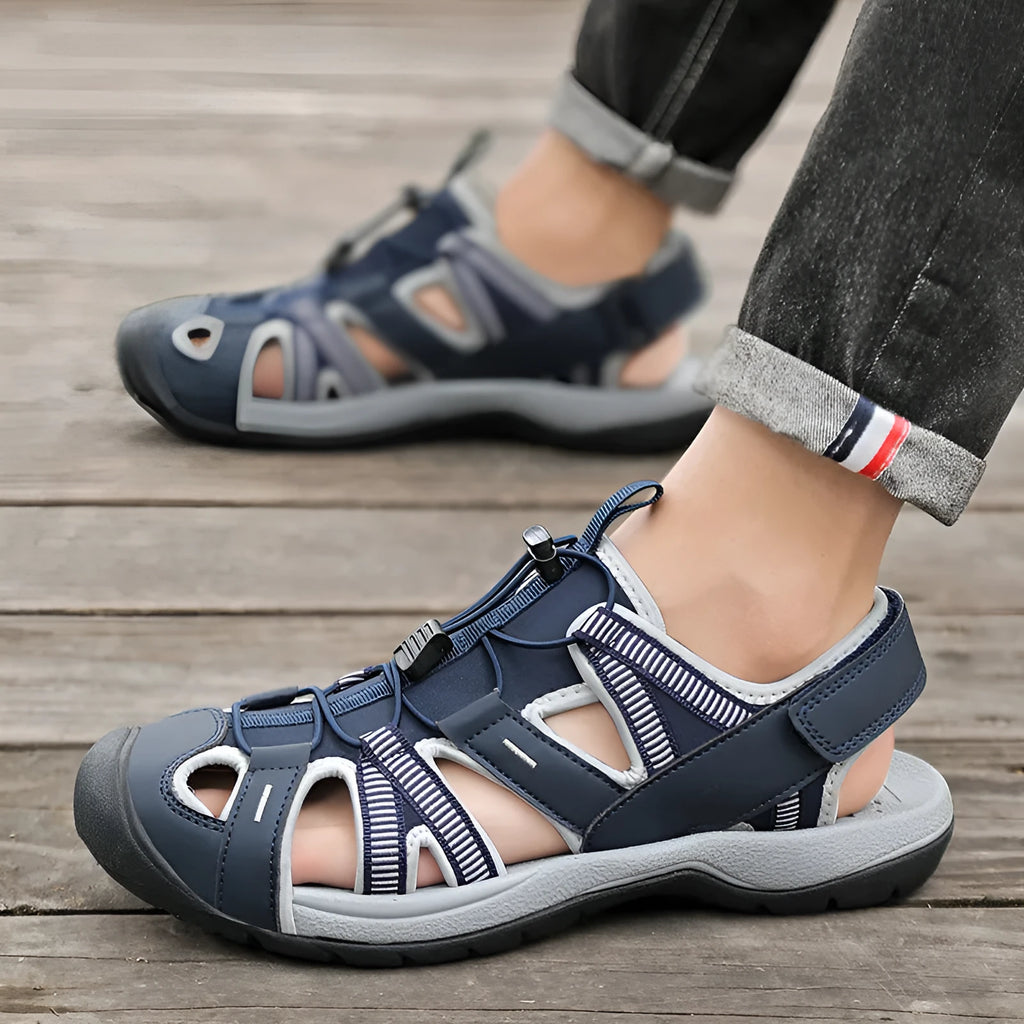 Men's blue summer sports shoes with mesh upper and Velcro fastening displayed on white background