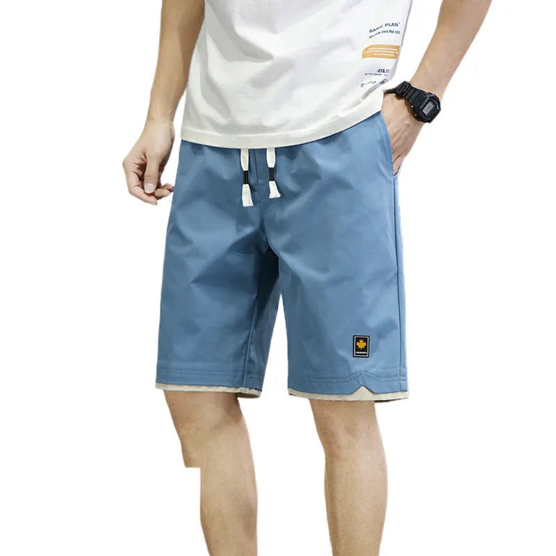 Korean style loose straight-leg beach shorts in 8905 green, available in sizes M to 8XL.