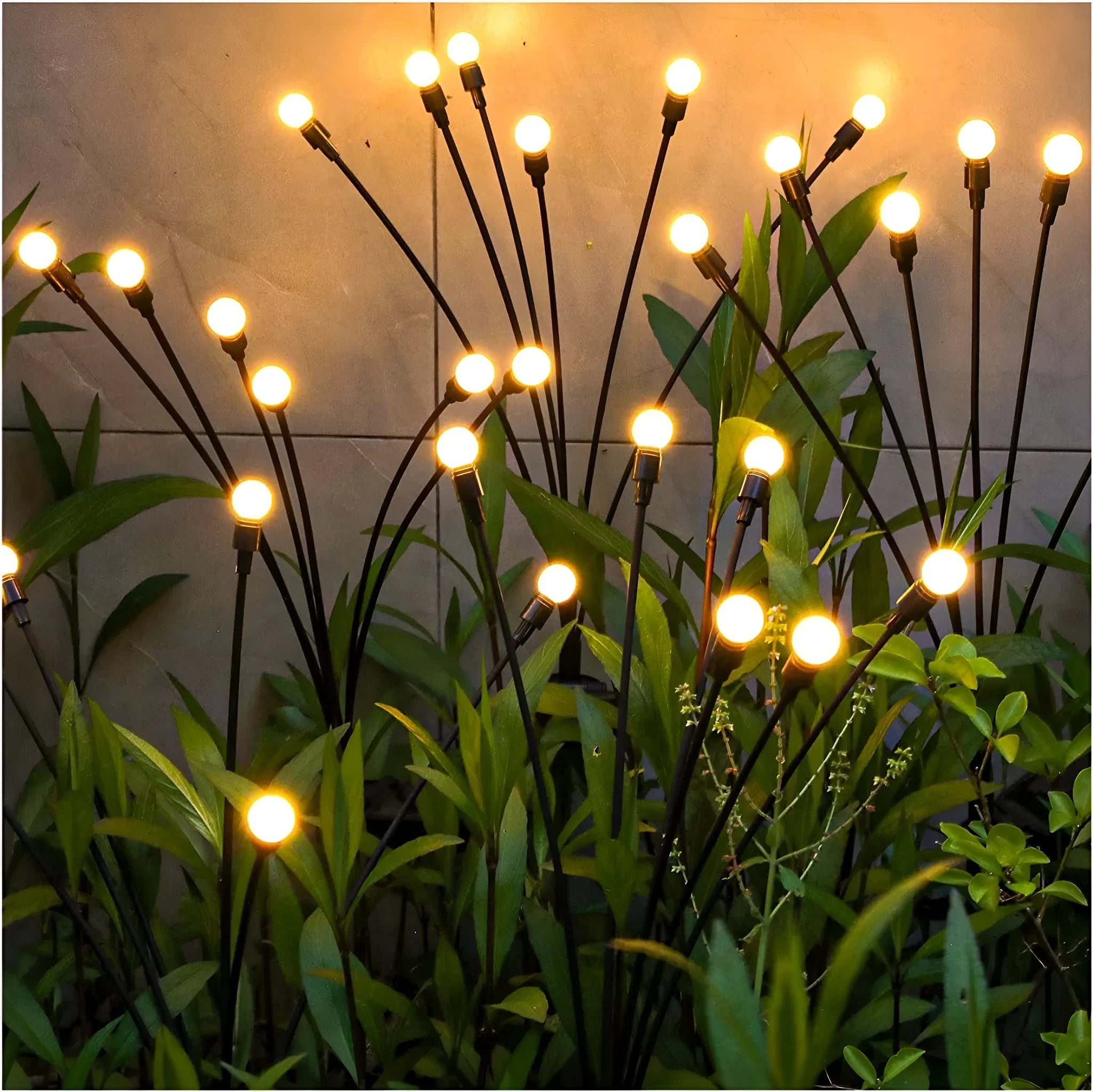 Solar-powered LED garden spike light with stainless steel ground plug stuck in soil.