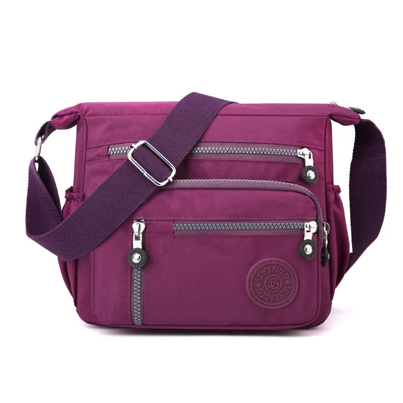 Grey soft nylon messenger bag with single shoulder strap showing square vertical shape