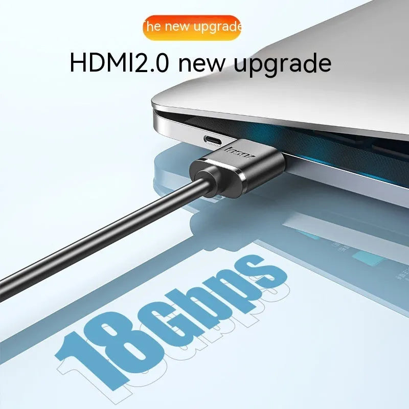 A thin, flexible HDMI cable with gold-plated connectors on a white background.