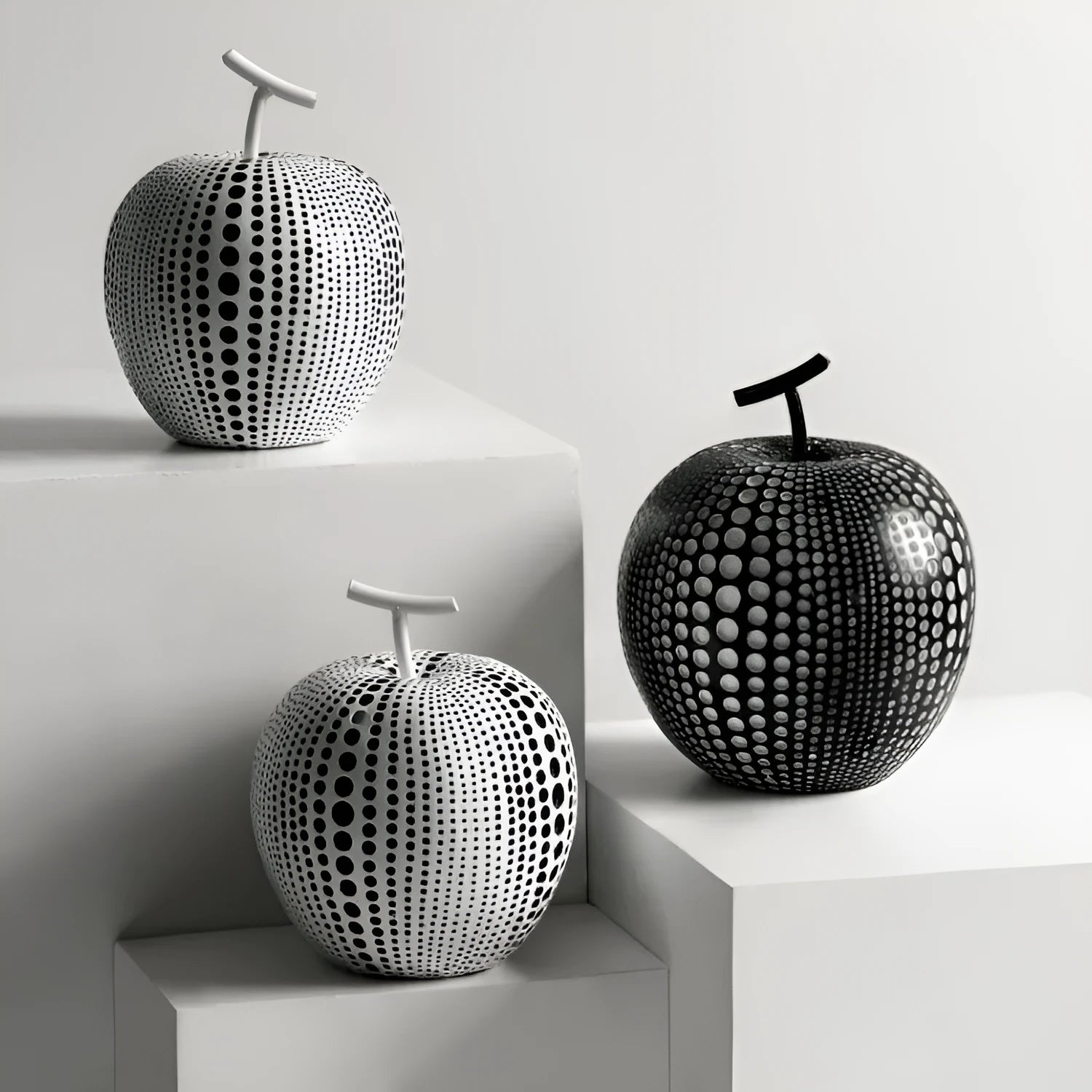 Resin fruit decoration crafts in white, orange, black and blue colour variations showing high and low profile designs