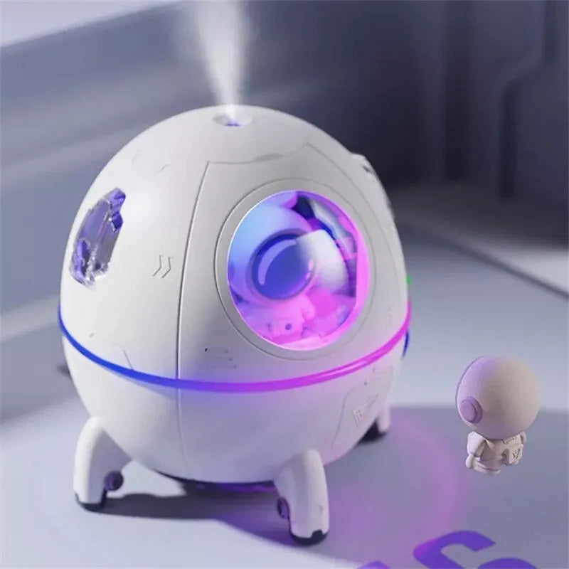 Astronaut-themed USB desktop humidifier with purple casing and colourful LED lighting