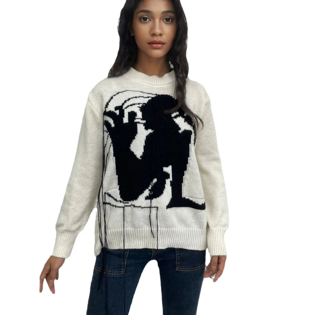 Women's grey alpaca wool sweater with abstract pattern and tassel design on front