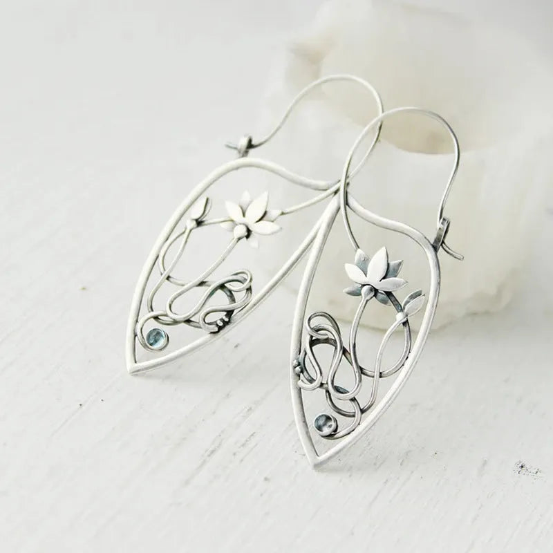 Silver lotus vine design rhinestone earrings with floral geometric pattern