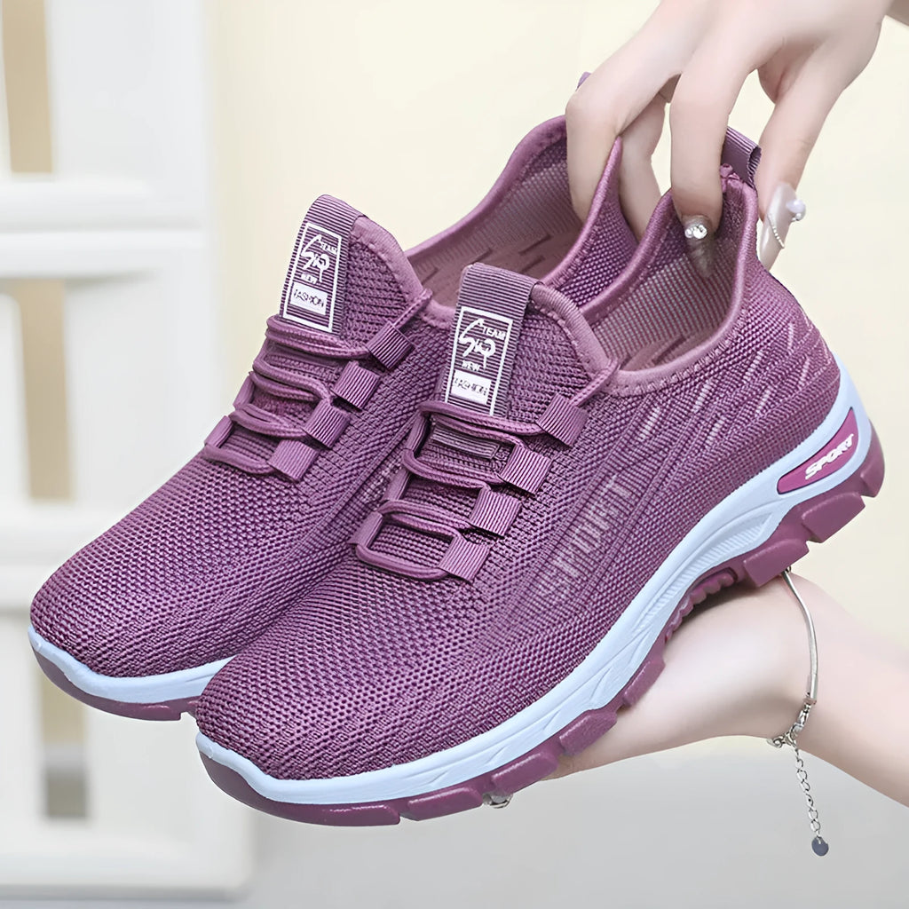 Low-top casual sneakers with a round toe and PVC sole, shown in available colours for men and women.
