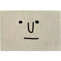 Square PVC floor mat with cartoon Mr Big Nose face and geometric pattern on a grey background.