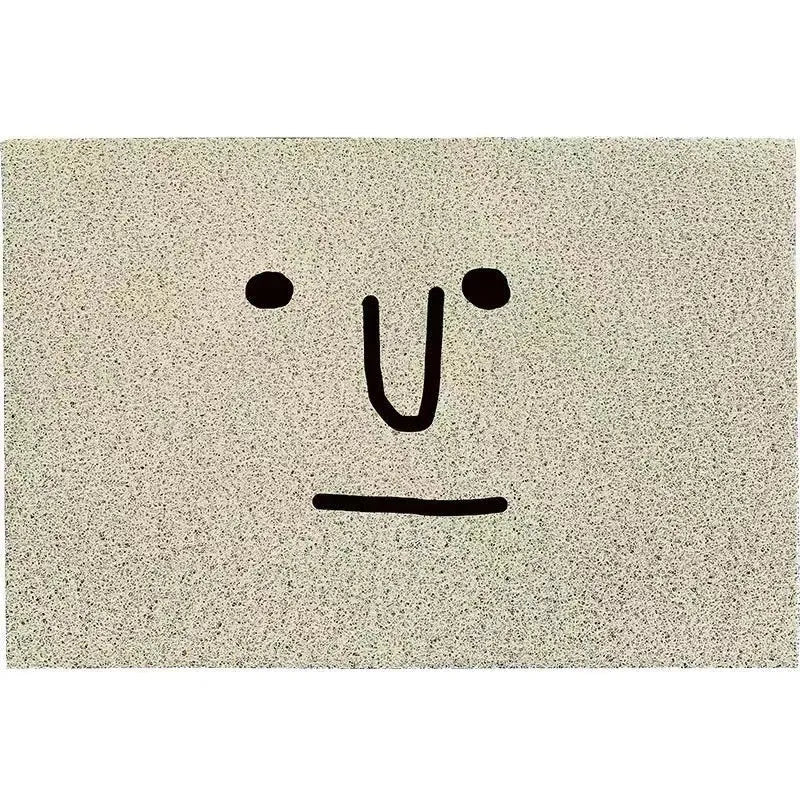 Square PVC floor mat with cartoon Mr Big Nose face and geometric pattern on a grey background.
