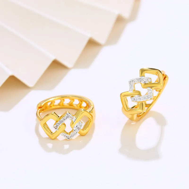 Gold geometric hollow-out alloy earrings with ear clip fastening and colour separation electroplating