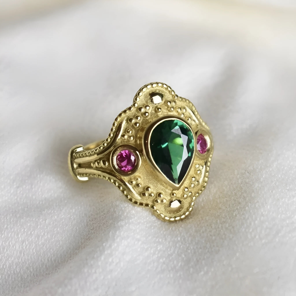 Golden geometric women's fashion ring on display showing electroplated finish and geometric design details