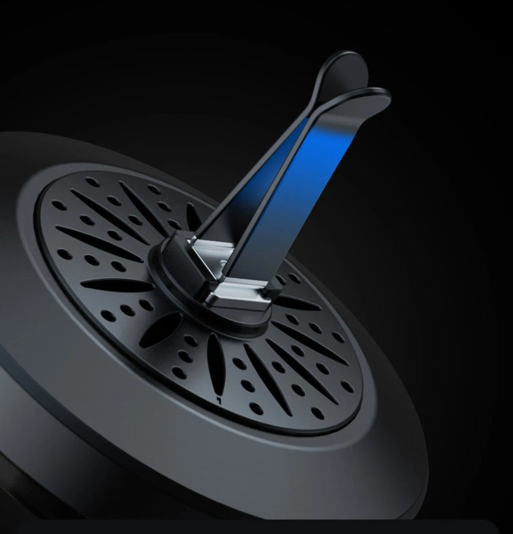 Car air vent aromatherapy unit with colourful RGB lights and a 3D vent clip attachment.