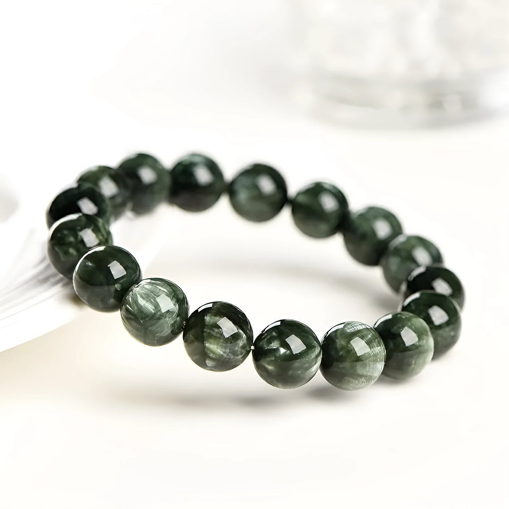 Green Dragon Crystal bracelet with round 8-9mm beads and a single ring clasp.