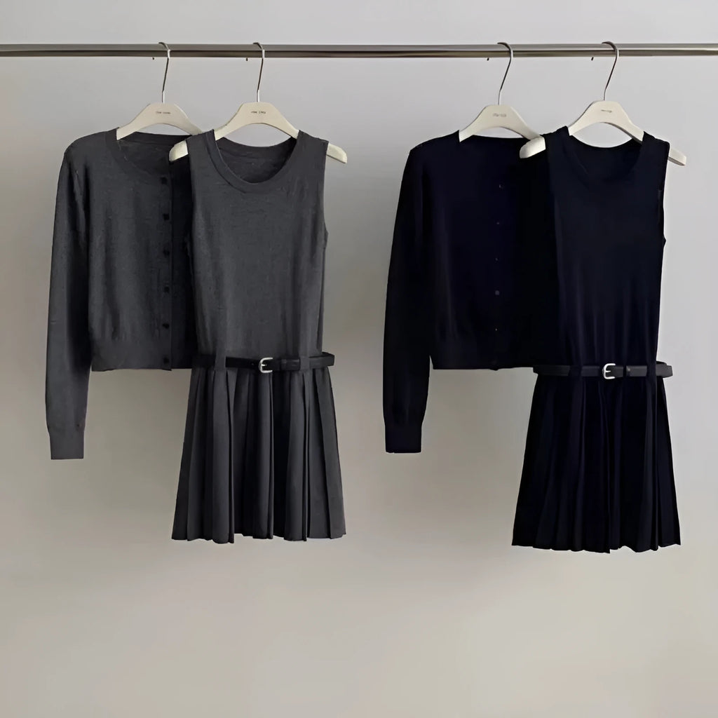 Women's black art retro knitted vest skirt and long sleeve cardigan two-piece set with belt.