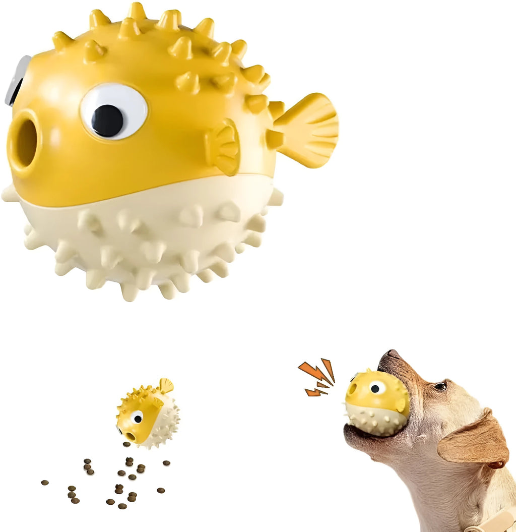 Green fish-shaped dog toy with squeaky bell and treat-dispensing opening