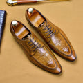 Black men's leather loafers with a silver horsebit buckle on a pointed toe, side view.