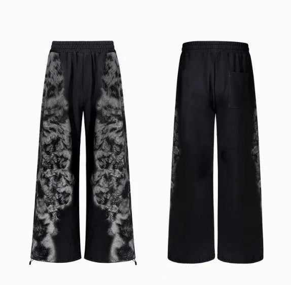 Women's loose printed polyester streetwear set showing hoodie, trousers, and seven-inch shorts.