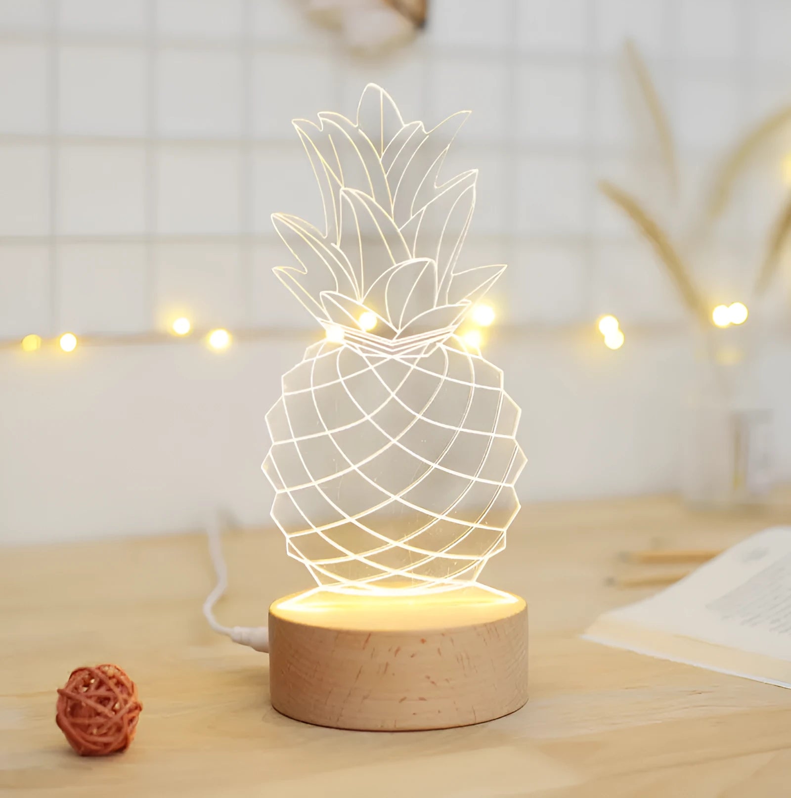 Cartoon pineapple-shaped bedside table lamp made from wood and acrylic with a USB cable.