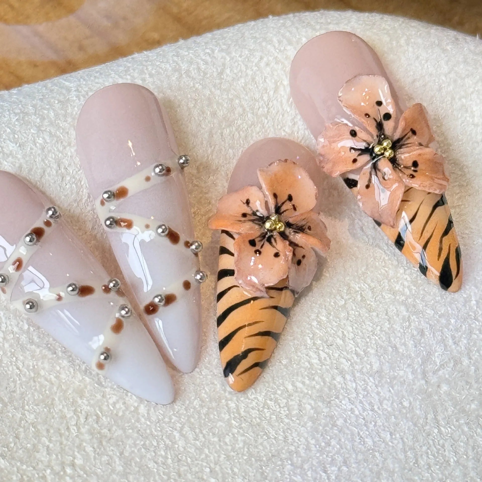 Handmade French style gel nail art stickers with leopard, cross and floral prints in four sizes.