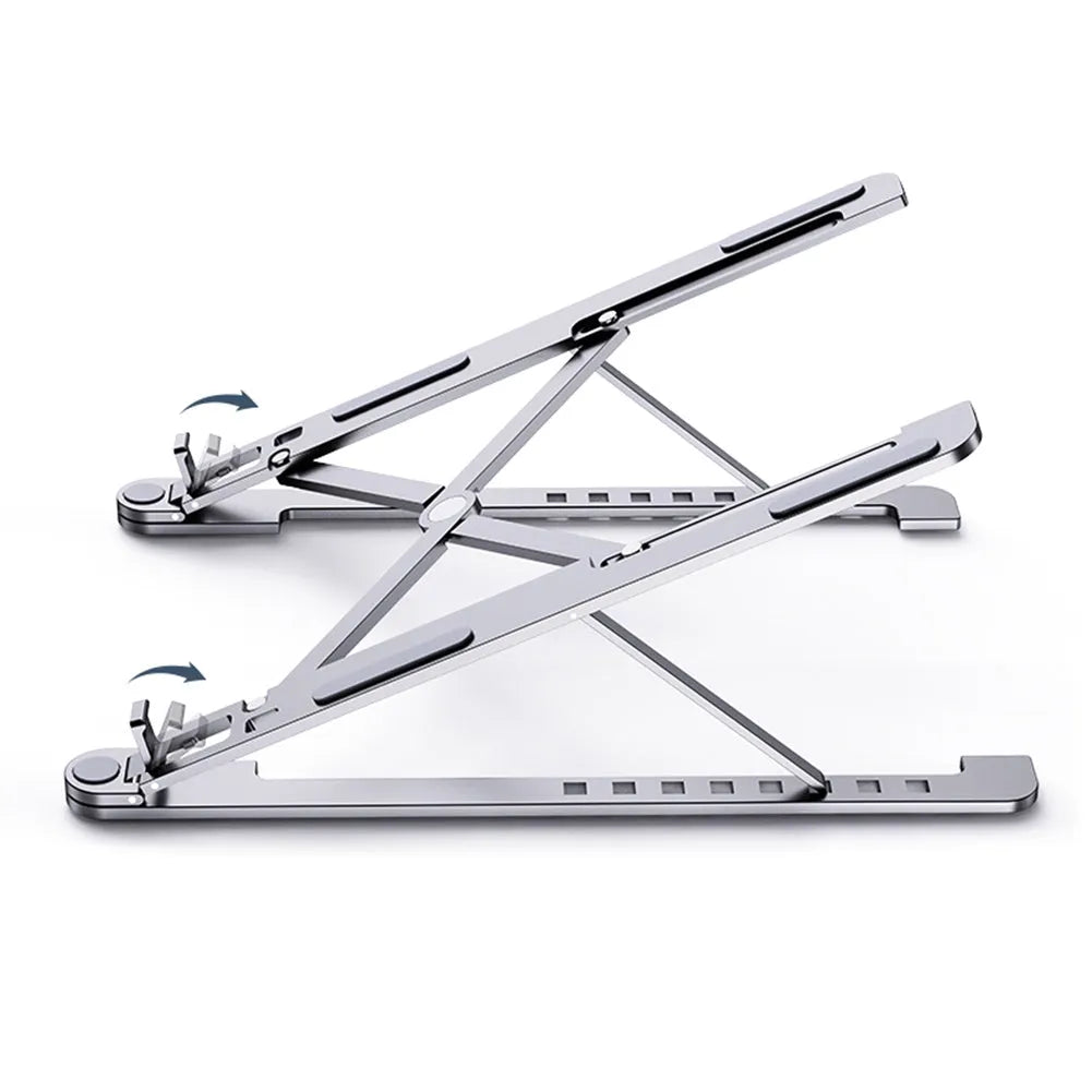 Aluminium laptop stand in silver, folded flat next to an open laptop showing its adjustable height mechanism.