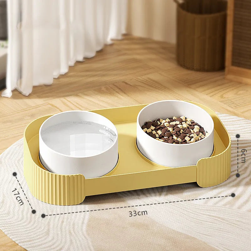 Green and white ceramic elevated cat bowls on a tilted stand with non-slip base