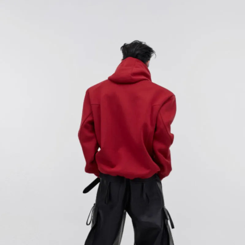 Men's black hooded sweater with heavy shoulder pads and silver metal-effect 3D printing detail.