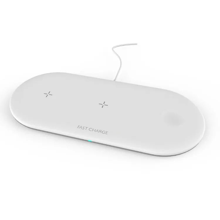 Black and white three-in-one wireless charging station for iPhone, Apple Watch and headphones on a desk.