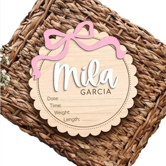 Customised square wooden baby ornament with a name for birthday or holiday decoration.