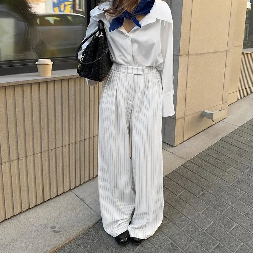 White striped women's wide-leg trousers with zip fastening and loose casual fit