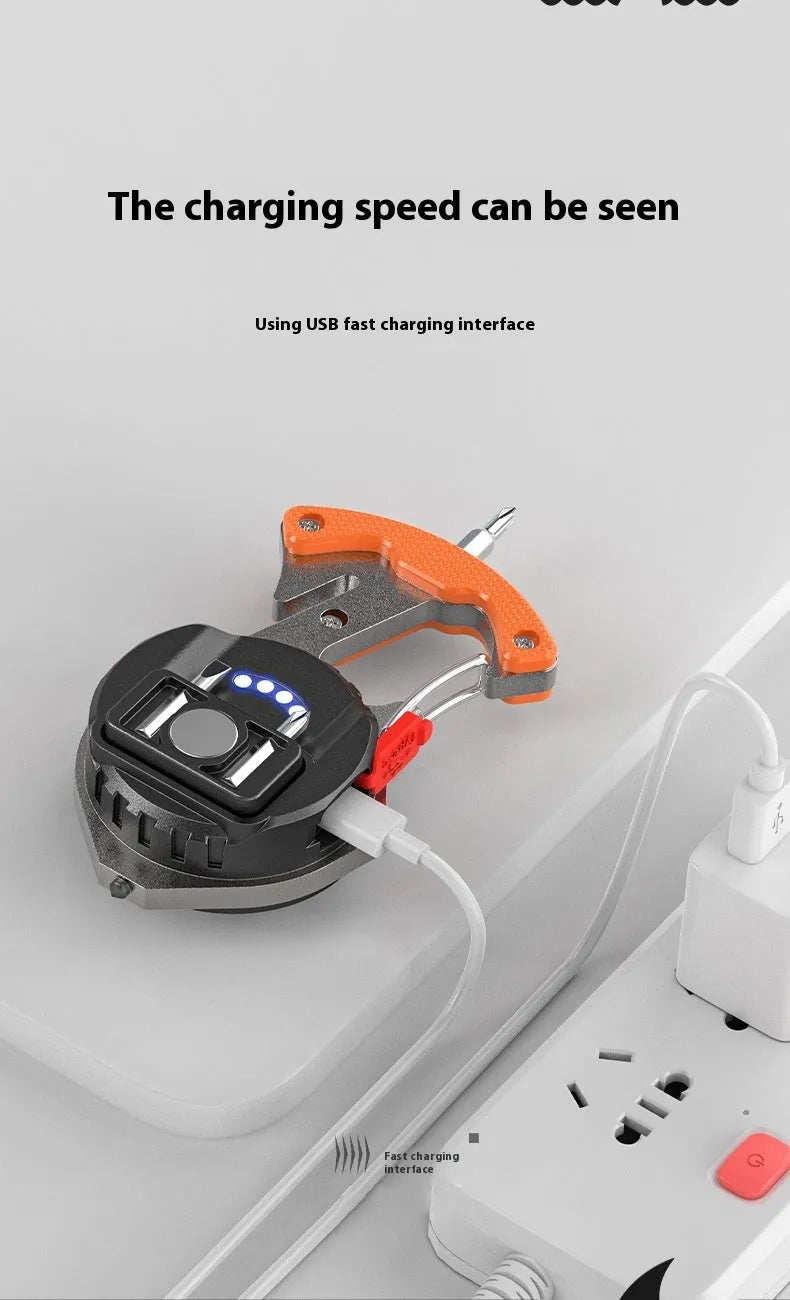 Compact silver and black multifunctional keychain flashlight with a window-breaking hammer tip and screwdriver.