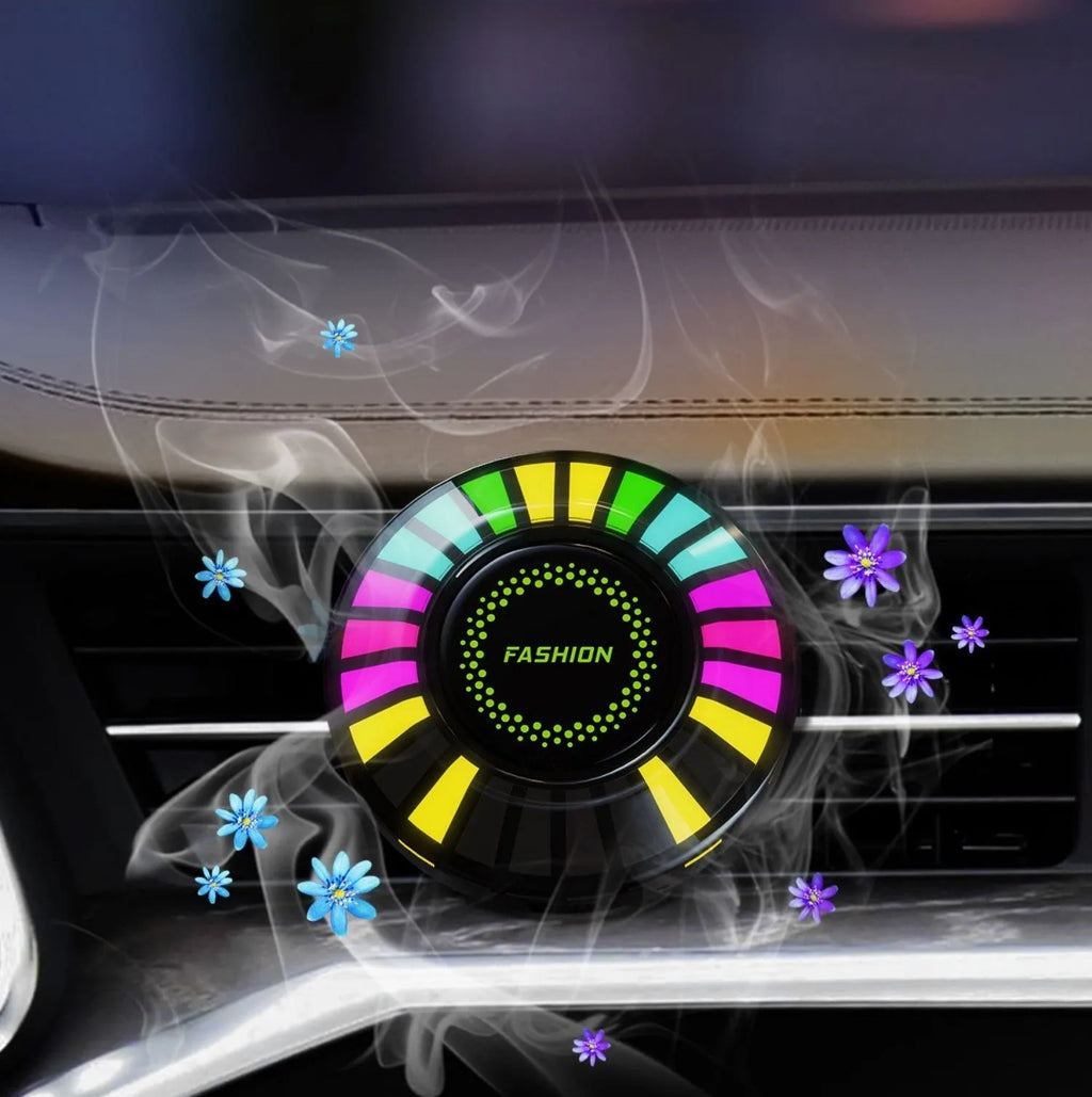 Car air vent aromatherapy unit with colourful RGB lights and a 3D vent clip attachment.