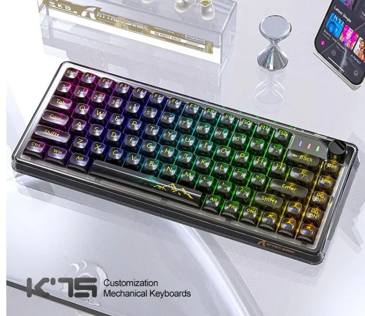Attack Shark K75RGB white transparent wireless mechanical keyboard with RGB lighting on a desk.